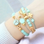 Schmuck in mintgr&uuml;nen T&ouml;nen von Polaris Elements Perlen mit goldenen Details 