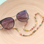 Sonnige Tage! DIY Sonnenbrillenkordel mit Kauri Muscheln, Pompoms, Makram&eacute; und mehr!