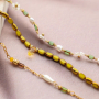 So wird aus ovalen Glasperlen mit goldfarbenem Rand schicker Schmuck 